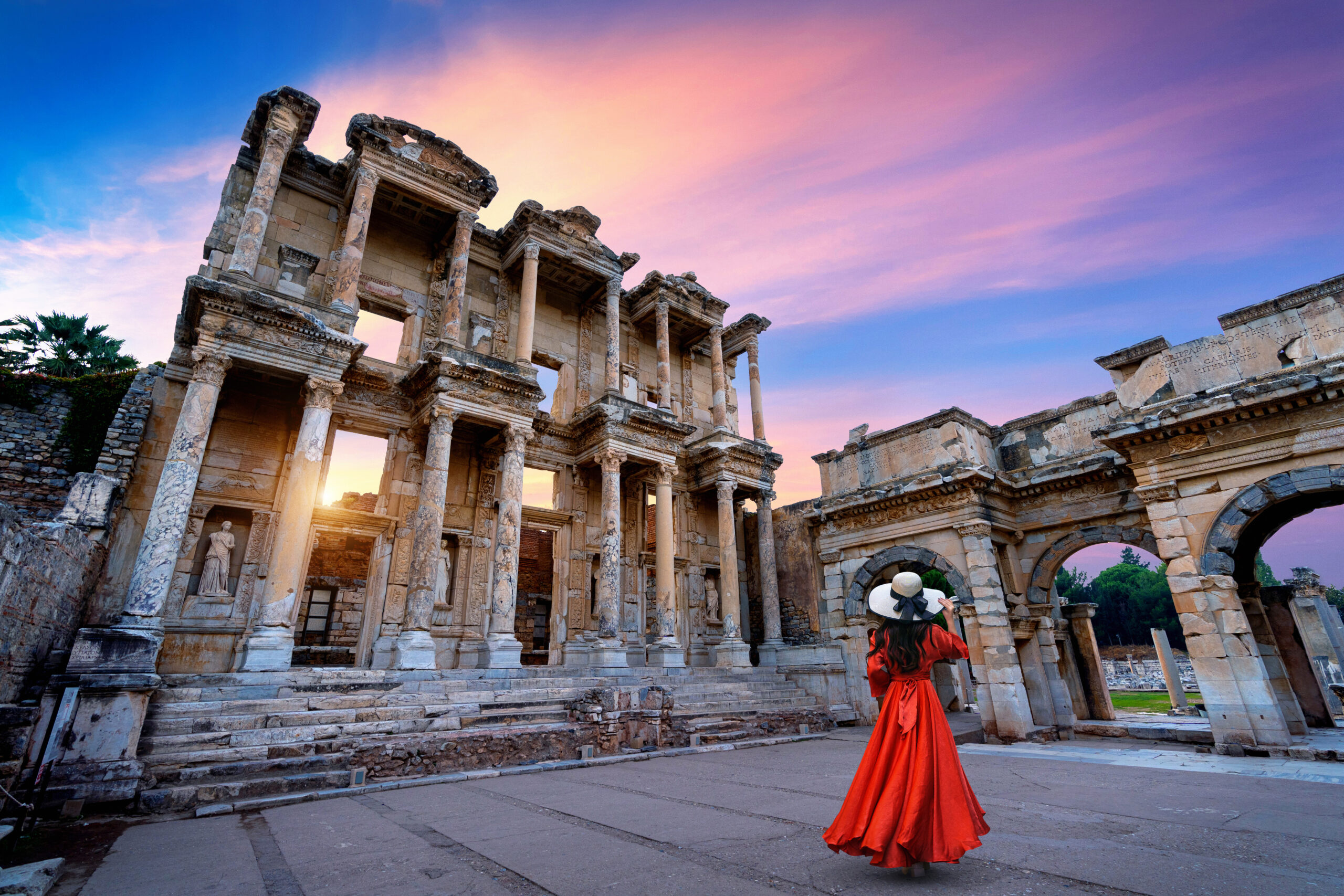 Woman standing in Celsus Library at Ephesus ancient city in Izmi